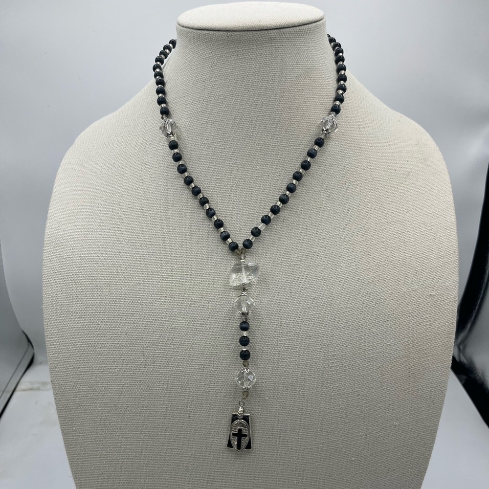 Black beaded rosary with white cross